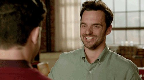 GIF of Schmidt and Nick from New Girl high fiving