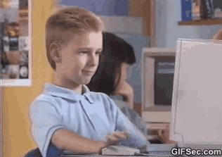 GIF of a kid researching on a computer and giving a thumbs up