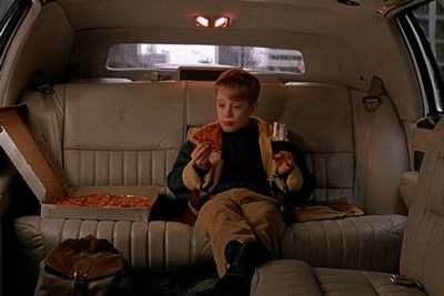 Kevin from Home Alone eating pizza