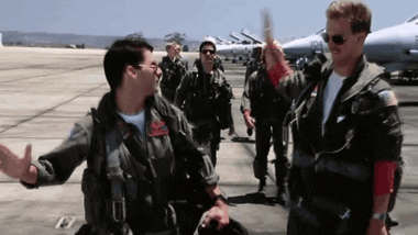 GIF of two Top Gun characters high fiving each other