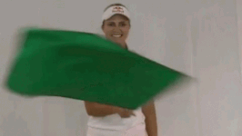 GIF of women waving green flag