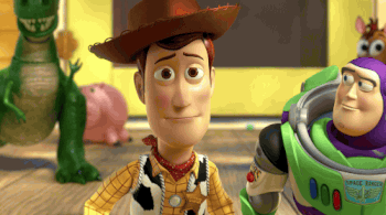 GIF of Buzz throwing an arm around Woody