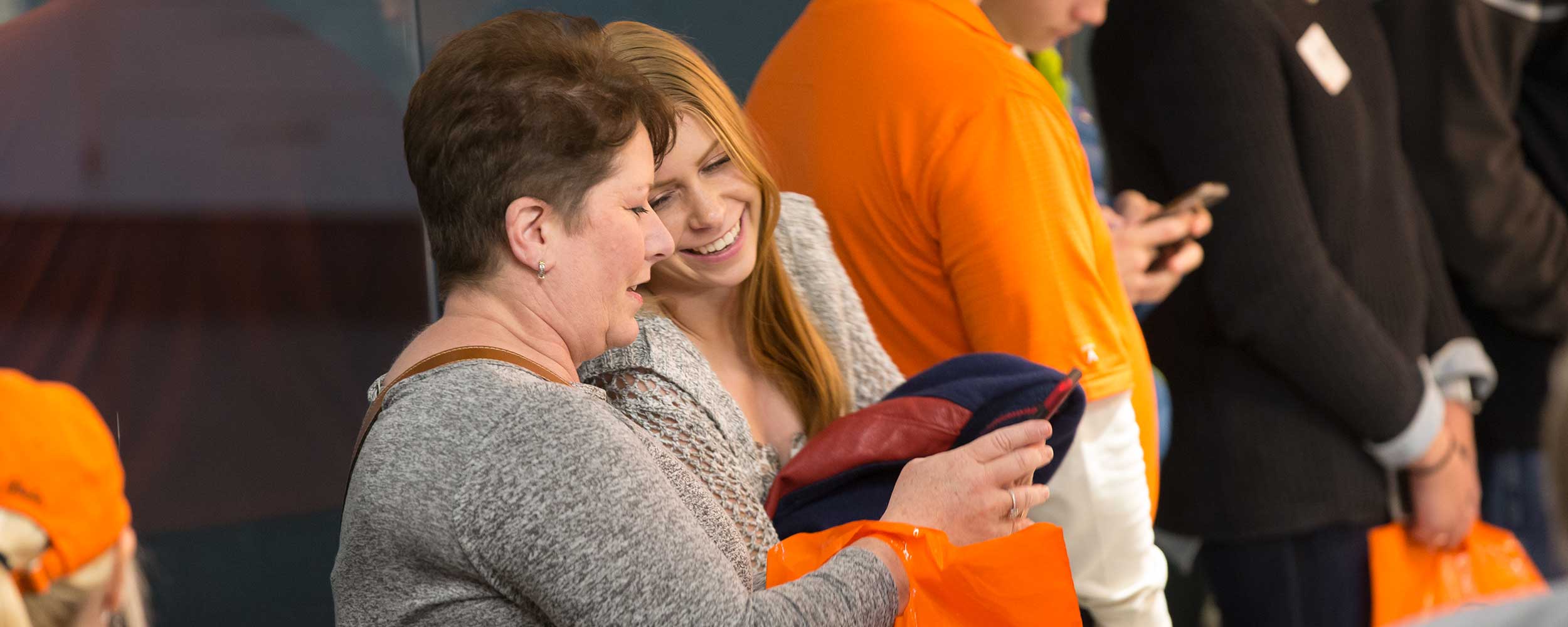 student smiling at parent