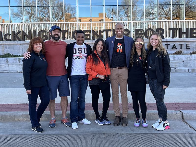 Some members of 2023 MLK Jr. Celebration Committee with student keynote speaker Tré Smith